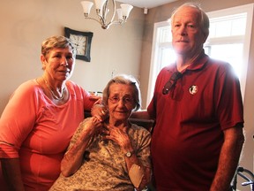 Mary Thompson, left, Elizabeth Silva and Paul Cook stand in Thompson's son's home in Sarnia, where the Florida residents are holding out until conditions on the ground in Florida improve in the wake of Hurricane Irma. Thompson and Cook who are married, brought Silva, their next-door neighbour with them as they escaped in advance of the storm.  Tyler Kula/Sarnia Observer/Postmedia Network