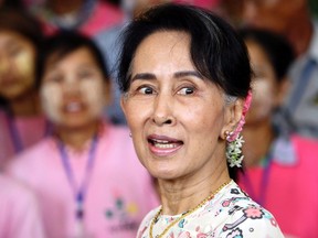 Myanmar's State Counsellor Aung San Suu Kyi turns around as she is celebrated her 72nd birthday at the parliament building in Naypyitaw, Myanmar, on June 19, 2017. (Aung Shine Oo/AP Photo/Files)