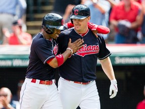 Francisco Lindor celebrates with Jay Bruce of the Cleveland Indians after both scored during the first inning on a home run by Bruce at Progressive Field on Sept. 13, 2017. (Jason Miller/Getty Images)