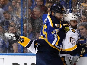 St. Louis Blues defenceman Colton Parayko checks Nashville Predators centre Vernon Fiddler against the glass during Game 2 on April 28, 2017. (AP Photo/Jeff Roberson)