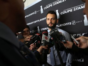 Clarke MacArthur of the Ottawa Senators talks to the media before boarding the plane at the Ottawa International Airport on May 24, 2017. (Jean Levac/Postmedia)