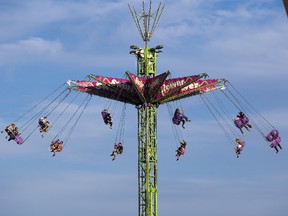 The Swing Tower was a popular ride with thrill seekers at the Western Fair in London Wednesday. (DEREK RUTTAN, The London Free Press)