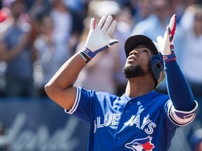 Toronto Blue Jays' Teoscar Hernandez gestures as he approaches home plate after hitting a three-run homer off Detroit Tigers pitcher Anibal Sanchez during MLB action in Toronto on Sept. 10, 2017. (THE CANADIAN PRESS/Chris Young)