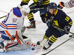 Edmonton Oilers rookie goalie Stuart Skinner (left) stops a shot by MacEwan-NAIT All-Stars Jake Mykitiuk (right) during third period game action at the 2017 Rookie Game held at Rogers Place in Edmonton on Wednesday September 13, 2017. The All-Stars defeated the Oiler rookies by a score of 2-0.