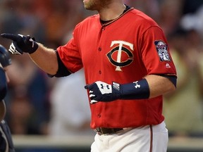 Brian Dozier of the Minnesota Twins celebrates after hitting a solo home run on Sept. 12, 2017 at Target Field in Minneapolis, Minnesota. (HANNAH FOSLIEN/Getty Images)