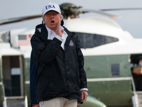 President Donald Trump responds to a reporters question as he boards Air Force One with first lady Melania Trump, not shown, for a trip to Florida to meet with first responders and people impacted by Hurricane Irma, Thursday, Sept. 14, 2017, in Andrews Air Force Base, Md. (AP Photo/Evan Vucci)