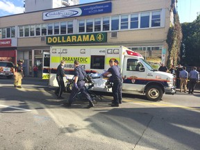 Police gathering witnesses in parking lot to write statements. Another witness says two pedestrians were struck (Jon Willing, Postmedia)