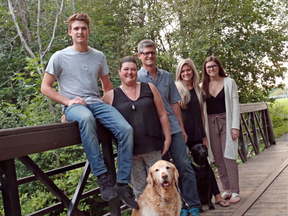 Lisa D'Eon is fighting cancer.  She is seen here with her family. L to R: Tyler D'Eon, Lisa D'Eon, Eric D'Eon, Chelsea Laughren and Ashley D'Eon. Dogs are Samson (L) and Griffin (R).  (Jean Levac, Postmedia)