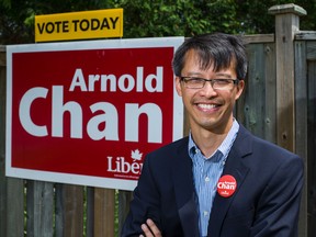 Arnold Chan candidate for the Scarborough-Agincourt riding - poses for a photo near Warden Ave and Huntingwood Dr. in Toronto, Ont. on Monday June 30, 2014. (Ernest Doroszuk/Toronto Sun)