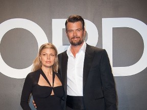 Singer Fergie and actor Josh Duhamel arrive at The Tom Ford Autumn/Winter 2015 Women's Wear Collection Presentation in Los Angeles, California, February 20th, 2015. AFP PHOTO / Valerie Macon (Photo credit should read VALERIE MACON/AFP/Getty Images)