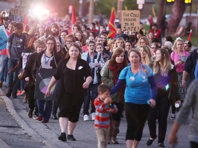 Participants march during the annual Take Back The Night in Sudbury on Sept. 29, 2016. The event featured a group gathering then a community march through the downtown streets and is aimed at  ending violence against women. Hundreds took part in the event. (Gino Donato/Sudbury Star)