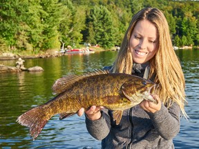 Columnist Ashley Rae with a smallmouth bass from Kashagawigamog Lake in Haliburton. (Submitted photo)