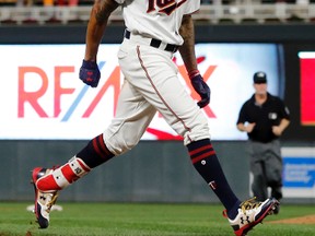 Minnesota Twins' Byron Buxton heads for home on his solo walkoff home run off Toronto Blue Jays pitcher Luis Santos during the 10th inning of a baseball game Thursday, Sept. 14, 2017, in Minneapolis. The Twins won 3-2. (Jim Mone/AP Photo)