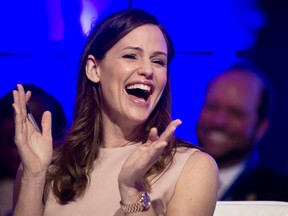 In this Feb. 25, 2017, file photo, actress Jennifer Garner reacts to a momentary malfunction of her microphone while addressing the National Governors Association Winter Meeting about early education, in Washington. Garner posted a video of herself on Instagram Sept. 14, 2017, in which she laughs and talks with slurred speech after a dental appointment while emotionally praising a song from the musical “Hamilton.” (AP Photo/Cliff Owen, File)