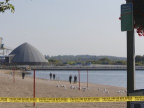 The morning after a fisherman found an unidentified woman's torso in Lake Ontario near the Oshawa Harbour, Durham Regional Police cordoned off a beach and searched along the waterfront for evidence on Tuesday, Sept. 11, 2017. (Chris Doucette/Toronto Sun)