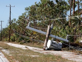Wood utility poles snapped by Hurricane Irma's high winds remained down on Thursday on Big Pine Key, Florida. Many places in the Keys still lack water, electricity or mobile phone service and residents are still not permitted to go further south than Islamorada. Entegrus crews were dispatched to Florida this week.