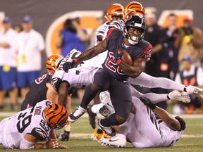 Lamar Miller of the Houston Texans runs with the ball against the Cincinnati Bengals during the second half at Paul Brown Stadium on Sept. 14, 2017. (John Grieshop/Getty Images)