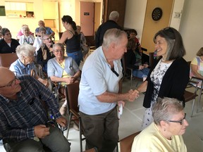 Kingston and the Islands MPP Sophie Kiwala greets RideauCrest Towers residents at a press conference announcing funding for energy-efficient retrofits to social housing in Kingston, Ont. on Friday, Sept. 15, 2017. 
Elliot Ferguson/The Whig-Standard/Postmedia Network