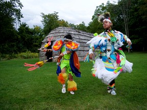 Griffin Sands (left) and Mason Sands stand in First Nations regalia by the replica longhouse at the Museum of Ontario Archaeology. The MOA’s annual celebration of indigenous art, music, and culture takes place during Doors Open London this weekend. CHRIS MONTANINI\LONDONER\POSTMEDIA NETWORK