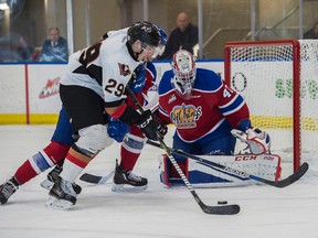 Goalie Travis Child of the Edmonton Oil Kings,  watches for the shot from Hunter Campbell of the Calgary Hitmen at the Community Rink in Rogers Place in Edmonton on September 10, 2017.