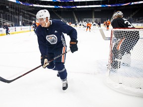 Ryan Strome, left, looks for the puck during the Edmonton Oilers training camp at Rogers Place in Edmonton on Friday, Sept. 15, 2017.