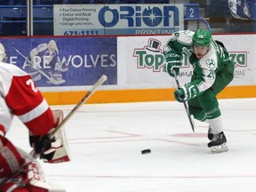 Anthony Tabak, right, of the Sudbury Wolves, fires a puck at goalie Dougie Newhouse, of the Soo Greyhounds, during OHL exhibition action at the Sudbury Community Arena in Sudbury, Ont. on Friday September 15, 2017. John Lappa/Sudbury Star/Postmedia Network