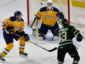 Erie goaltender Anand Oberoi keeps his eye on Knights forward Richard Whittaker's shot with Erie defence man Jack Duff during a pre-season game played at Budweiser Gardens in London, Ontario on Friday September 15, 2017 MORRIS LAMONT/THE LONDON FREE PRESS /POSTMEDIA NETWORK