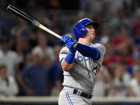 Justin Smoak of the Toronto Blue Jays hits a solo home run against the Minnesota Twins during an MLB game on Sept. 14, 2017 at Target Field. (Hannah Foslien/Getty Images)