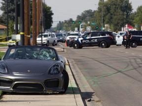 Police block off the scene were the driver of a Porsche injured eight bystanders after losing control of the sports car near the Boise Spectrum 21 theaters Saturday, Sept. 16, 2017 in Boise, Idaho. Police say the driver of the gray Porsche accelerated rapidly while leaving the Cars and Coffee event but lost control and ran into the nearby crowd. Ambulances took six people to hospitals and two others were taken by private vehicles. Police didn't provide any names or conditions. 
(Darin Oswald/Idaho Statesman via AP)