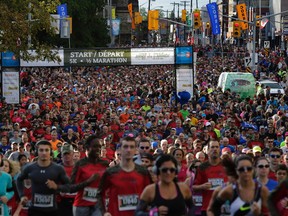 Waves of runners make their way up Elgin Street at the start of the Canada Army Run on Sept. 18, 2016.