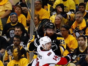 Senators’ Alex Burrows delivers a hit during last season’s series against the Pittsburgh Penguins. (GETTY IMAGES)