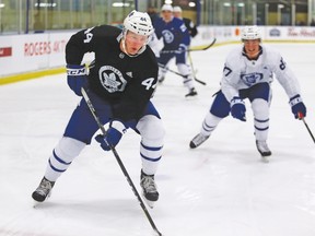 Leafs defenceman Morgan Reilly chases the puck during Saturday’s training camp scrimmage in Niagara Falls. (Dave Abel, Toronto Sun)