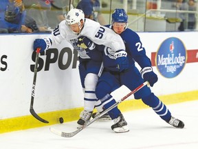 Winger Kasperi Kapanen (right) leans into Nolan Valleau during yesterday’s Maple Leafs scrimmage Leafs at the Gale Centre in Niagara Falls. The Leafs open their exhibition schedule tomorrow night against the Ottawa Senators. (Dave Abel, Toronto Sun)