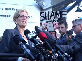 Premier Kathleen Wynne speaks to media at a courthouse in Sudbury, Ont. on Wednesday September 13, 2017. The premier was testifying at the trial of Pat Sorbara, her former deputy chief of staff and Liberal campaign director, and Gerry Lougheed, a local Liberal organizer, who are charged with bribery under the Election Act and both have pleaded not guilty. Gino Donato/Sudbury Star/Postmedia Network