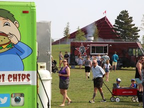 Visitors to Trenton's Centennial Park walk between several food trucks and booths at Food Trucks United presented by Hanon Systems Canada Inc.on Saturday September 16, 2017 in Trenton, Ont. The annual event is a fundraiser for the United Way Hastings and Prince Edward. Tim Miller/Belleville Intelligencer/Postmedia Network
