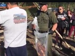 On Friday, about 30 people were learning about the process of smoking fish when fish and wildlife officers arrived and asked for fishing licenses. Photo: Facebook/Roxy Powder