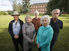 Posing in front of the former Grant School on Sept. 7 are, left to right, Graham Patterson, Millie Patterson, Geoffrey Sharpe, Veronica McGuire and Roland Reebs. The school has been vacant for a decade. Patrick Doyle/Postmedia