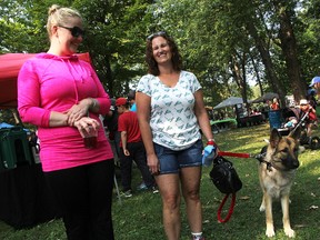 Rachel Rouw, left, Brandi Teahan, and Lucy, a one-year-old shiloh shepherd, prepare to walk Saturday at Canatara Park in a fundraiser for Heaven's Wildlife Rescue. The Oil Springs organization was hoping to raise enough money to reopen its doors to new admissions.  Tyler Kula/Sarnia Observer/Postmedia Network