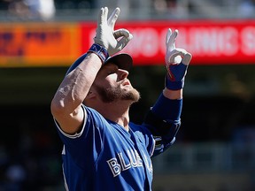 Toronto Blue Jays' Josh Donaldson celebrates his solo home run off Minnesota Twins pitcher Kyle Gibson in the first inning of a baseball game Sunday, Sept. 17, 2017, in Minneapolis. (AP Photo/Jim Mone)