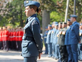 An air cadet stands in front of her contingent at the Battle of Britain parade at the RCAF Memorial in City Park on Sunday. (Steph Crosier/The Whig-Standard)