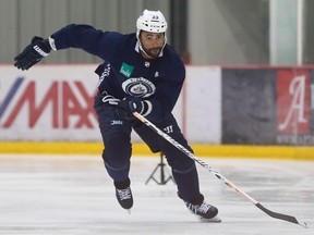 Winnipeg Jets' Dustin Byfuglien skates during speed trials on the second day of the Jets' training camp in Winnipeg on Friday, September 15, 2017. THE CANADIAN PRESS/John Woods