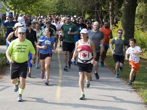 Terry Fox Run participants begin their trek at Springbank Gardens in London Sunday morning. (DEREK RUTTAN, The London Free Press)