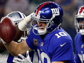 In this Sept. 10, 2017 file photo, Dallas Cowboys defensive end DeMarcus Lawrence (90) sacks New York Giants quarterback Eli Manning (10) in the first half of an NFL football game in Arlington, Texas. (AP Photo/Ron Jenkins)