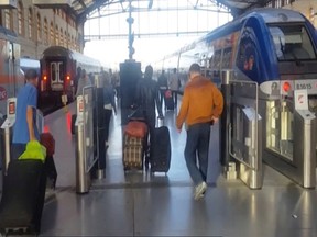 This image taken from video shows passengers inside Marseille-Saint-Charles railway station in Marseille, France on Sunday Sept. 17, 2017. (AP Photo)