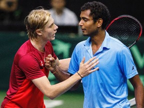 Canada's Denis Shapovalov, left, and India's Ramkumar Ramanathan congratulate each other after Davis Cup singles tennis in Edmonton, Alta., on Sunday September 17, 2017.