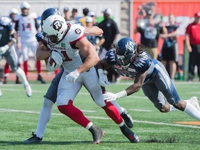 Ottawa Redblacks' fullback Patrick Lavoie (81) breaks through the Montreal Alouettes defense during first half CFL football action in Montreal, Sunday, September 17, 2017. Graham Hughes, The Canadian Press