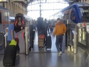 This image taken from video shows passengers inside Marseille-Saint-Charles railway station in Marseille, France on Sunday Sept. 17, 2017. (AP Photo)