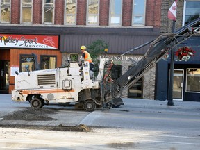 Main street traffic in Mitchell, from St. George Street to St. David Street, was detoured for approximately five hours last Thursday, Sept. 14 as three different contractors milled and paved around the concrete sidewalks in an attempt to try and reduce some of the noise. Lavis (pictured above) did the milling while Fraser Paving, of Stratford, completed the paving portion of the job. The Streetscape plan when the main street was shut down for months two years ago has been controversial ever since with noise the main concern. ANDY BADER/MITCHELL ADVOCATE