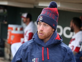 Winnipeg Goldeyes shortstop Andrew Sohn is bundled up in the dugout as his team faces the Wichita Wingnuts during Game 3 of the best-of-five American Association championship series on Sun., Sept. 18, 2017. Sohn was unable to play. Kevin King/Winnipeg Sun/Postmedia Network