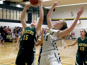 Erica Terrell of the Loyalist Lancers goes up for a rebound against Bryn Reynolds of the La Salle Black Knights during senior girls basketball action at the Taylor Allan Memorial Tournament on Sept. 15 at La Salle Secondary. The Kingston Area senior girls season tips off Tuesday. (Ian MacAlpine, The Whig-Standard)